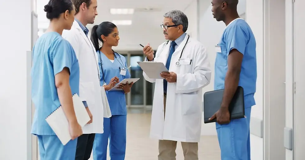 Clinical staff meeting in corridor – healthcare floor plan design optimizing staff circulation and compliance.