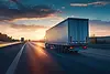 Integrated freight logistics showing cargo ship, semi truck, and airplane representing glo