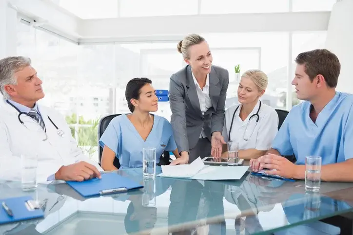 Consultant leading clinical team strategy session for accreditation, budgeting, and performance improvement – Laboratory Consulting Services.