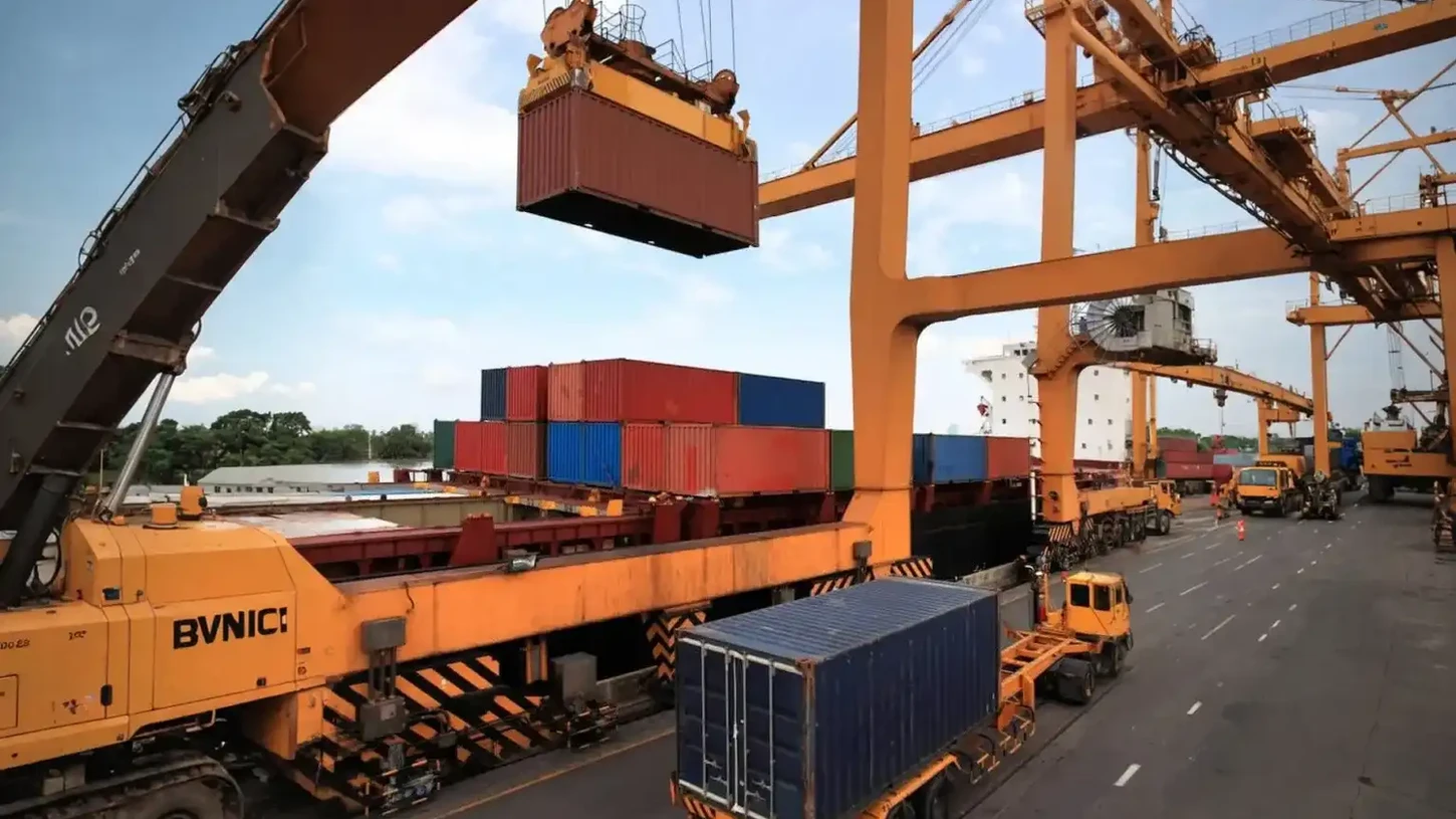 Container being loaded by crane onto truck at Hidden Hills ,California shipping port