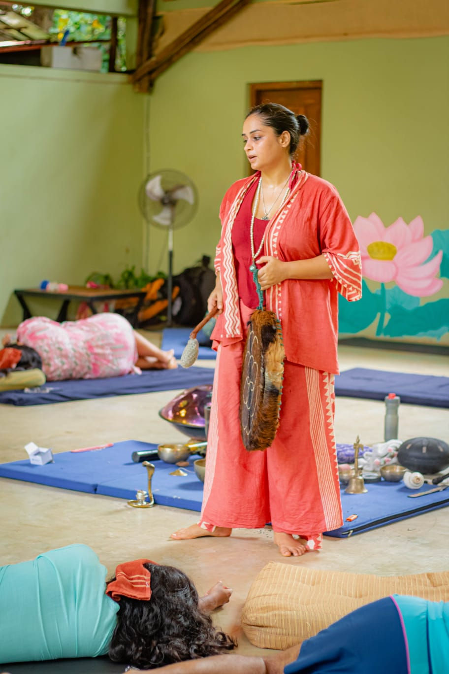 Roshni using the shamanic drum during her sound healing session.