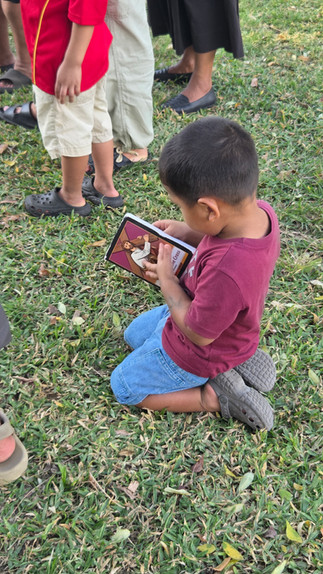 Sito diligently reads along during Stations