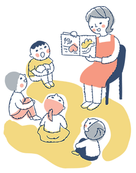 絵本を読む保育士
