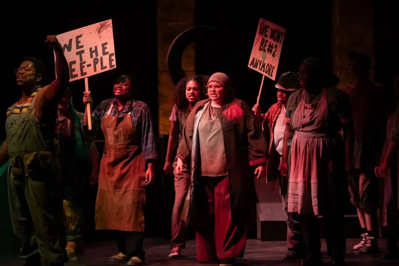 Image of Urinetown with the full scenic footprint.