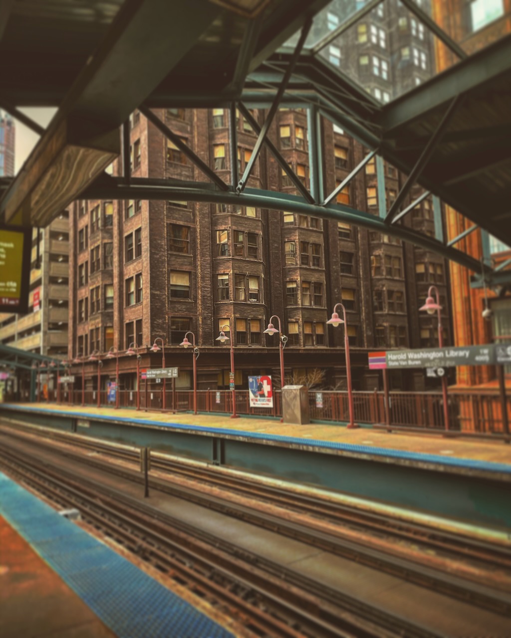 An elevated train platform with tracks and steel framing.