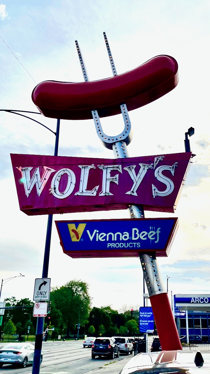 The Wolfy's Vienna Beef sign above the street.