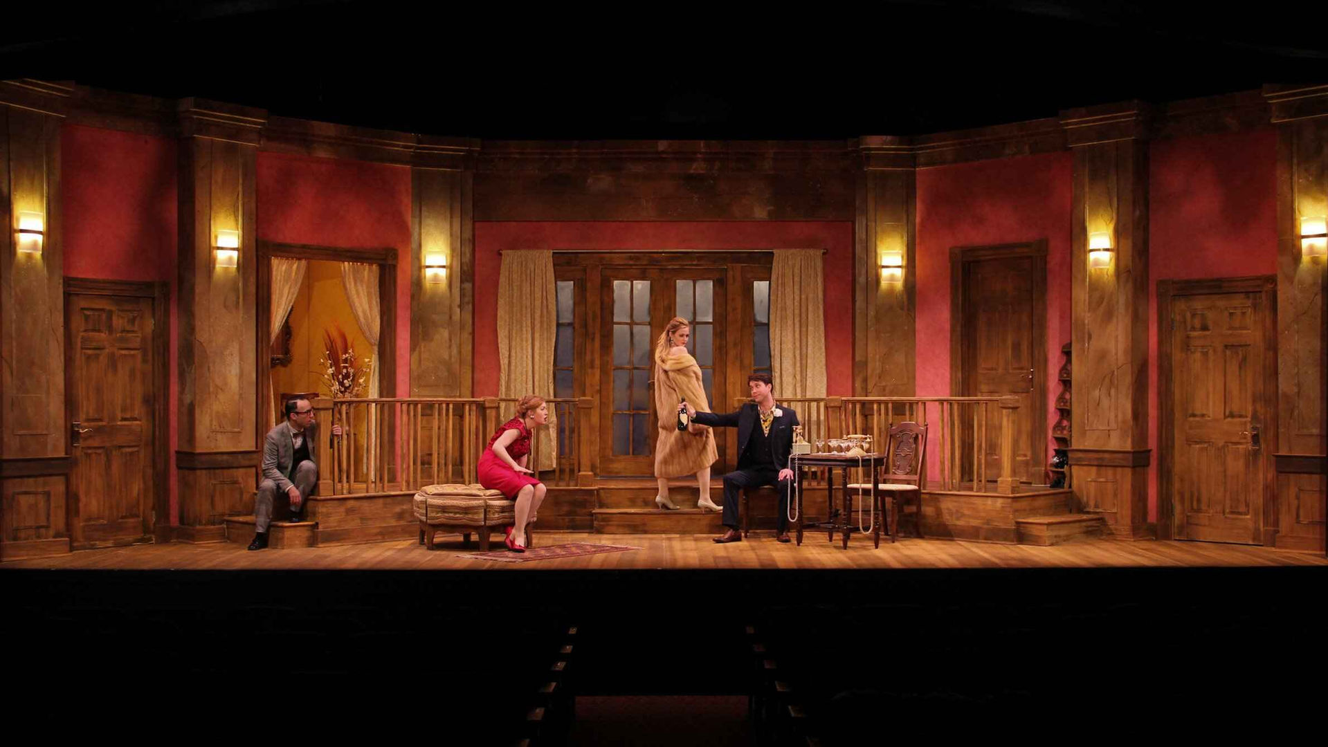 Full-stage view of the full comic boutique environment in performance.