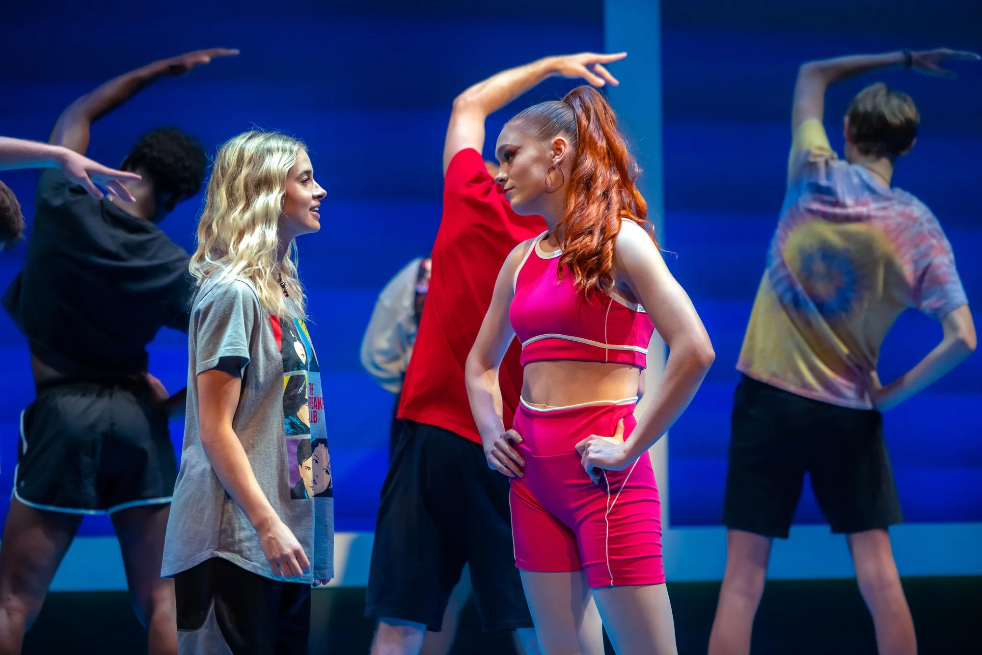 Scene highlighting ensemble flow through the Freaky Friday set.