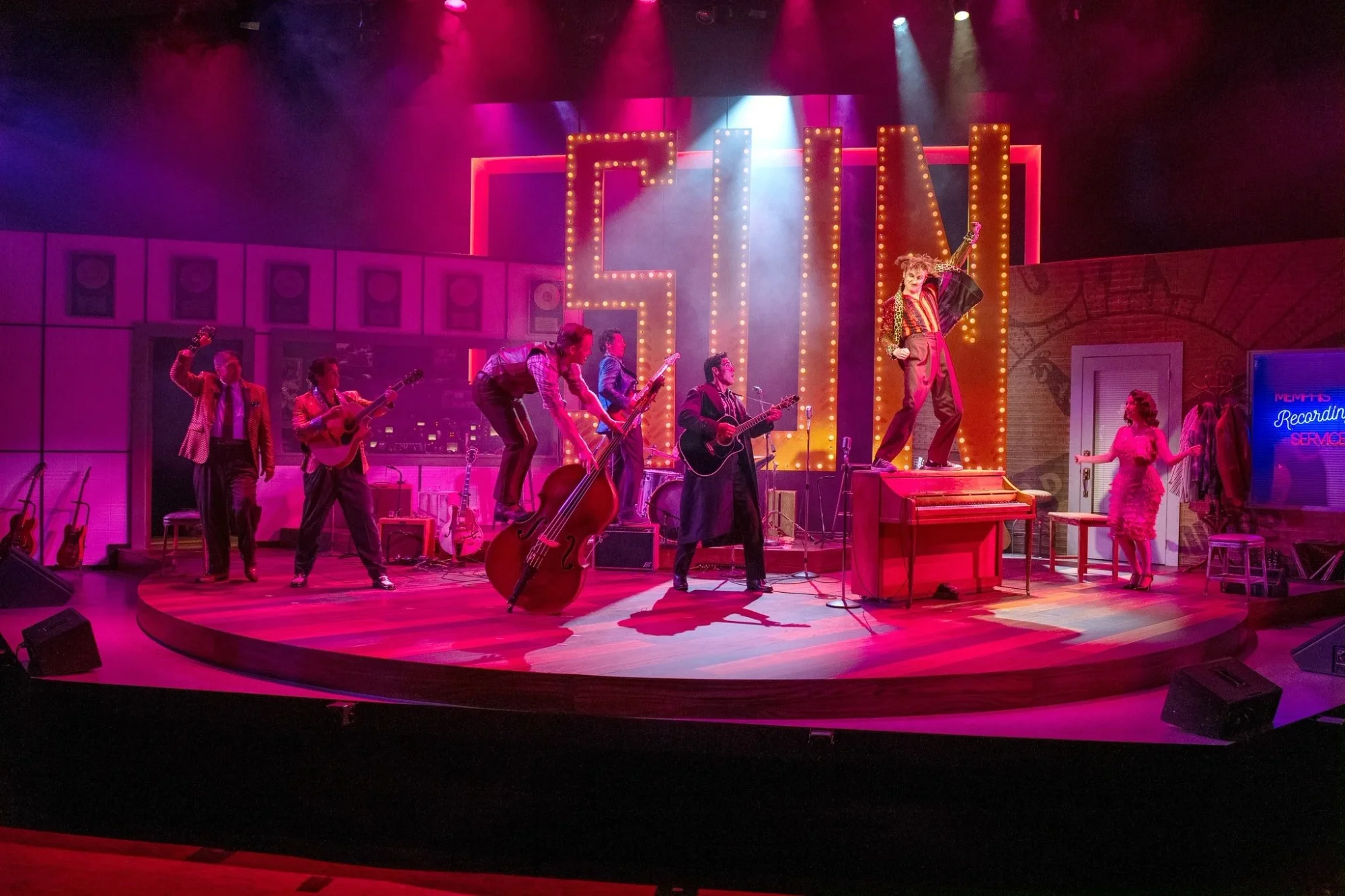 Cast blocking across the studio set architecture in Million Dollar Quartet.