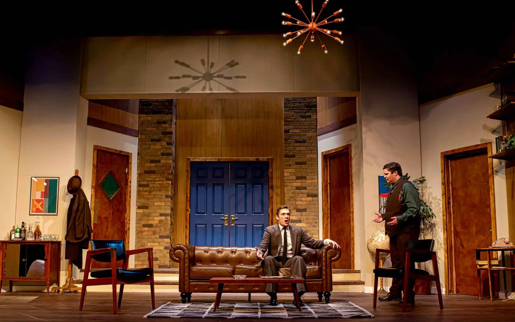 The apartment's furniture and graphic detail visible.