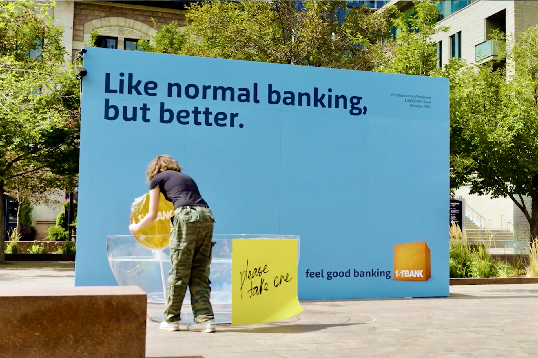 First Bank Lollipops campaign wall with oversized branded lollipops.