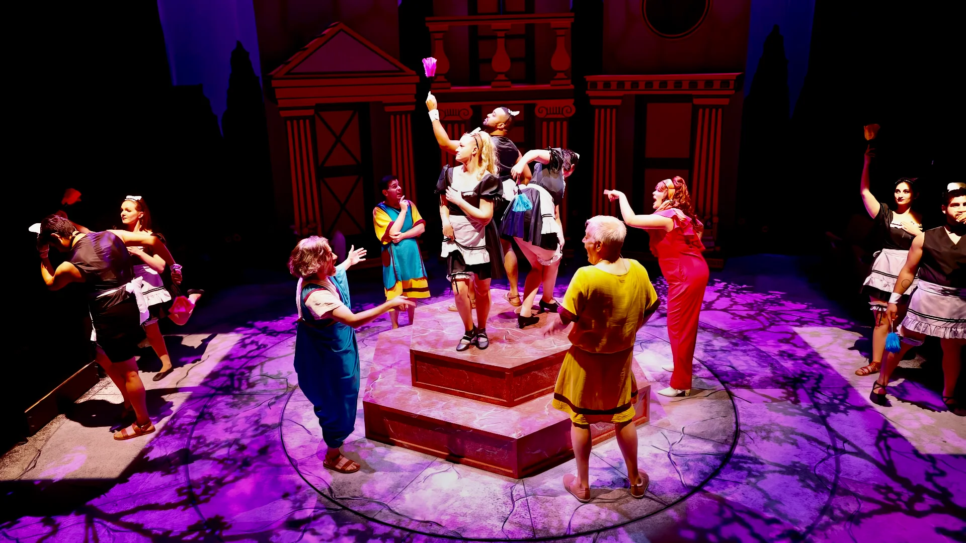 Actors moving through the farce-driven Roman architecture.
