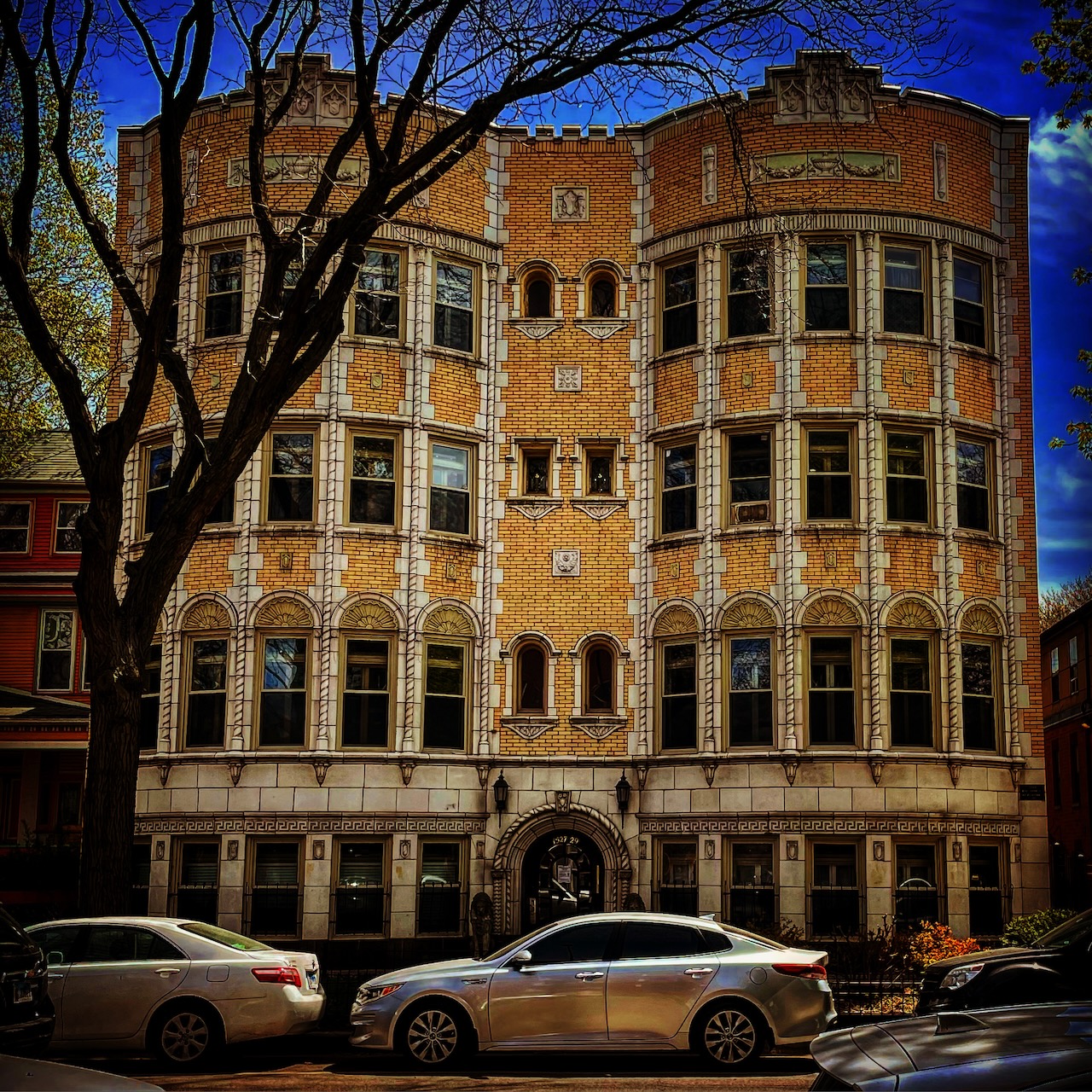A detailed brick apartment facade.