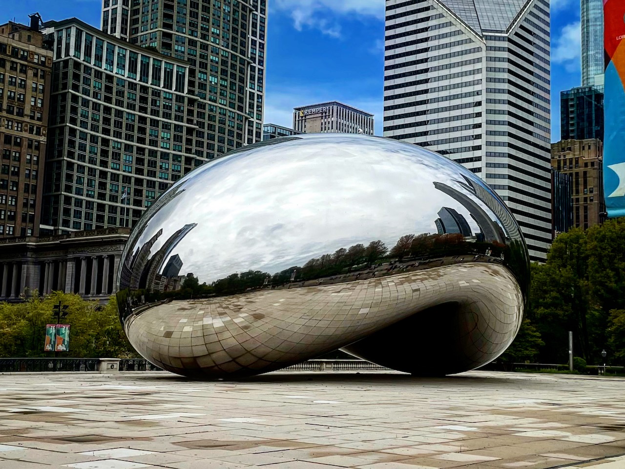 Cloud Gate reflecting the surrounding Chicago plaza.