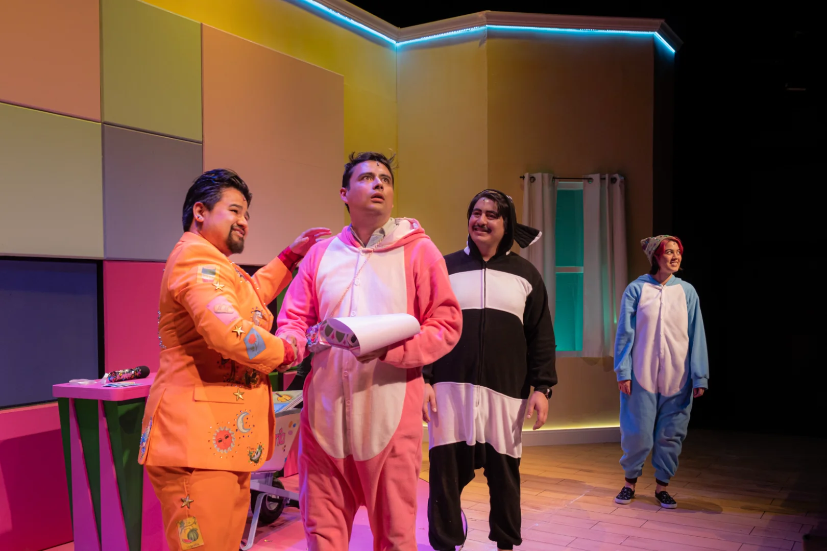 Performers inside the vibrant family-room set.