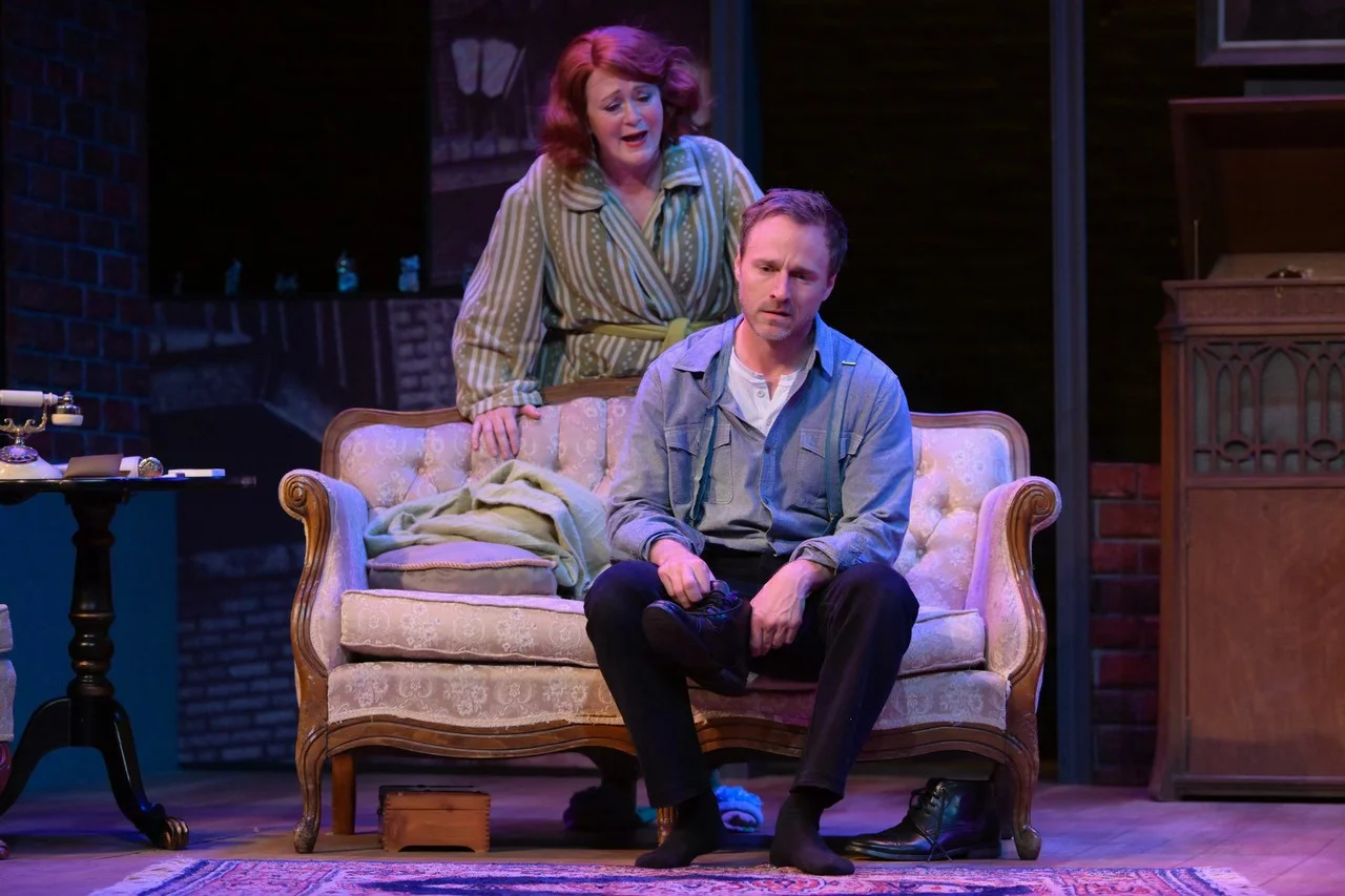 Scene emphasizing sightlines, negative space, and the elevated platform relationship in The Glass Menagerie.