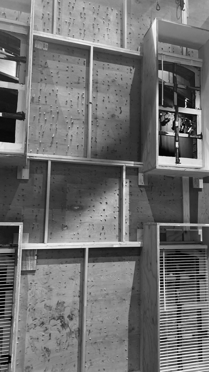Unfinished scenic wall units with window openings.