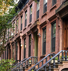 summer view of a row of stoops and hist