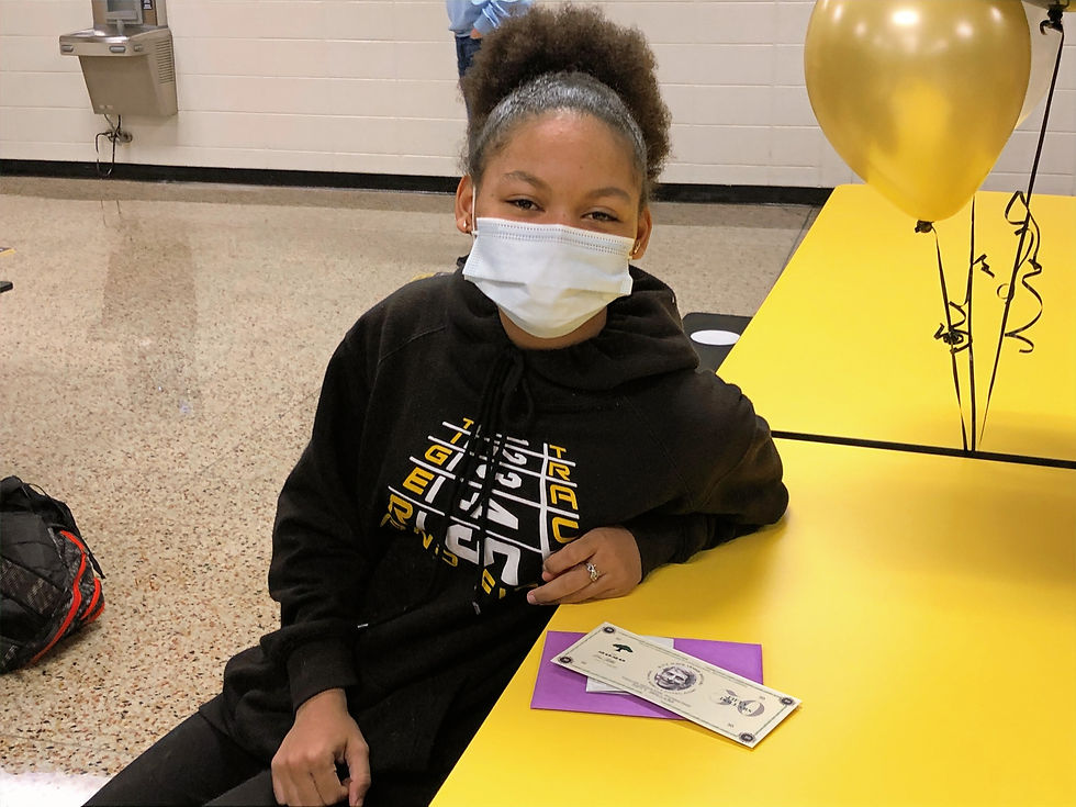 A student sits with a dave dollar
