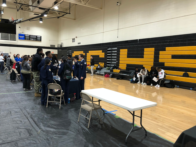 students at a career expo held in a gymnasium