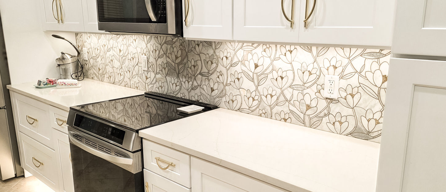 Kitchen backsplash detail with updated cabinetry and countertops by Hipo Homes