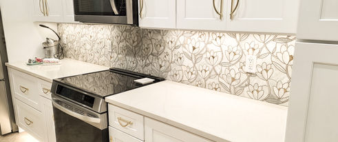 Kitchen backsplash detail with updated cabinetry and countertops by Hipo Homes