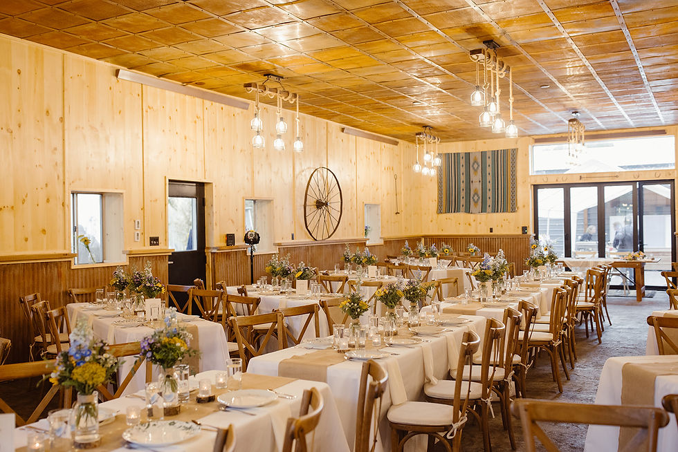 Eye-level view of elegant wedding reception hall with floral decorations