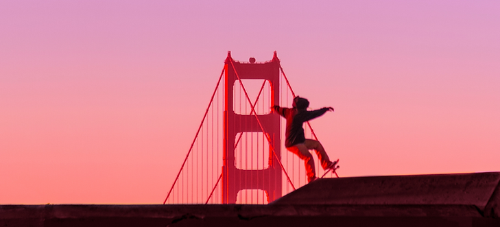 man riding on skateboard front of Golden