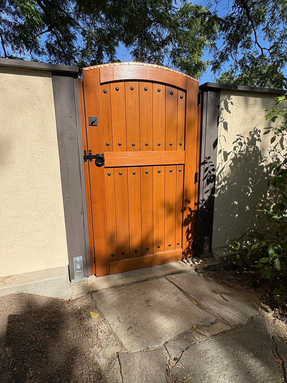 old-world wooden gate with timber and stucco fence wall in Seattle