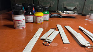 White watch bands being painted with Angelus Acrylic Paint