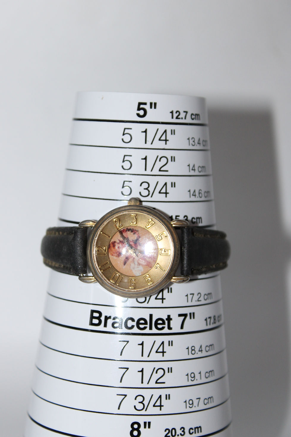 Thumbnail: Vintage Gold Tone Cherub Angel Face Black Band Watch