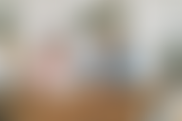 Smiling senior couple enjoying coffee in their living room – Aging in Place