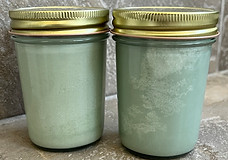 Two Eucalyptus & Thyme Candles showing frosting effect in the one one the right.