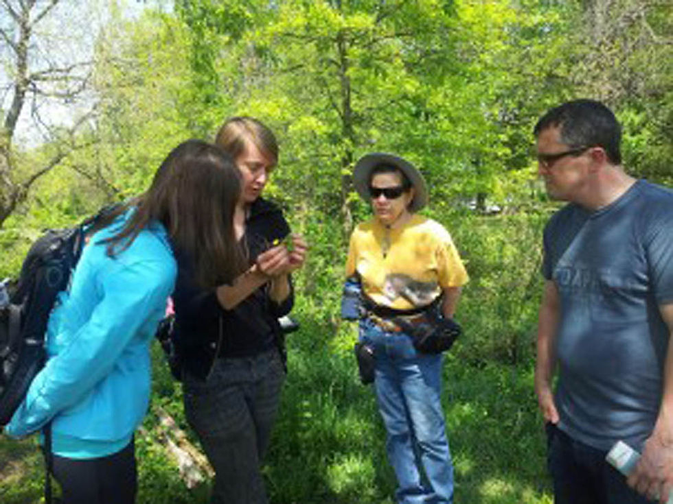 Inspecting Buttercup during April's Plant ID Walk