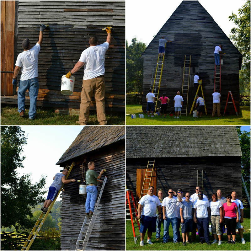 Painting "witches brew" on the tobacco barn to help preserve the wood