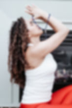 Women in a prayer position.