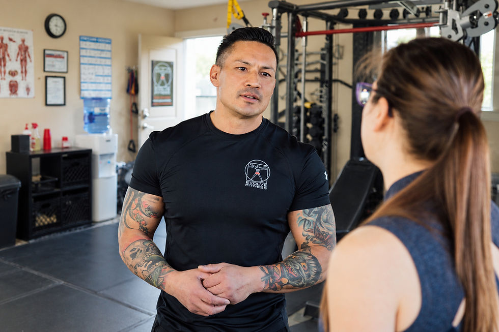 Kenton speaking with a client at his private personal training studio