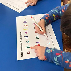 image showing children practicing letter skills