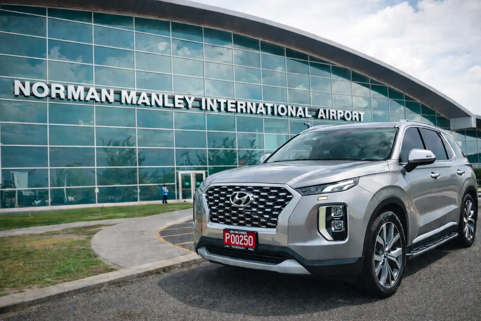 Aurum Transfers fleet vehicles lined up at a Jamaica airport