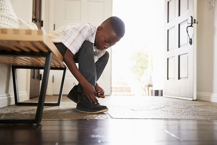 Boy Tying Shoes