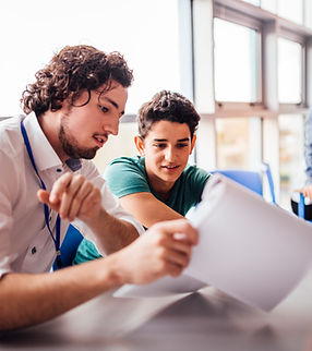 Teacher helping student