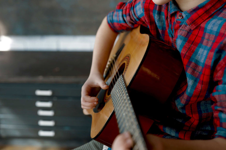 Playing Acoustic Guitar