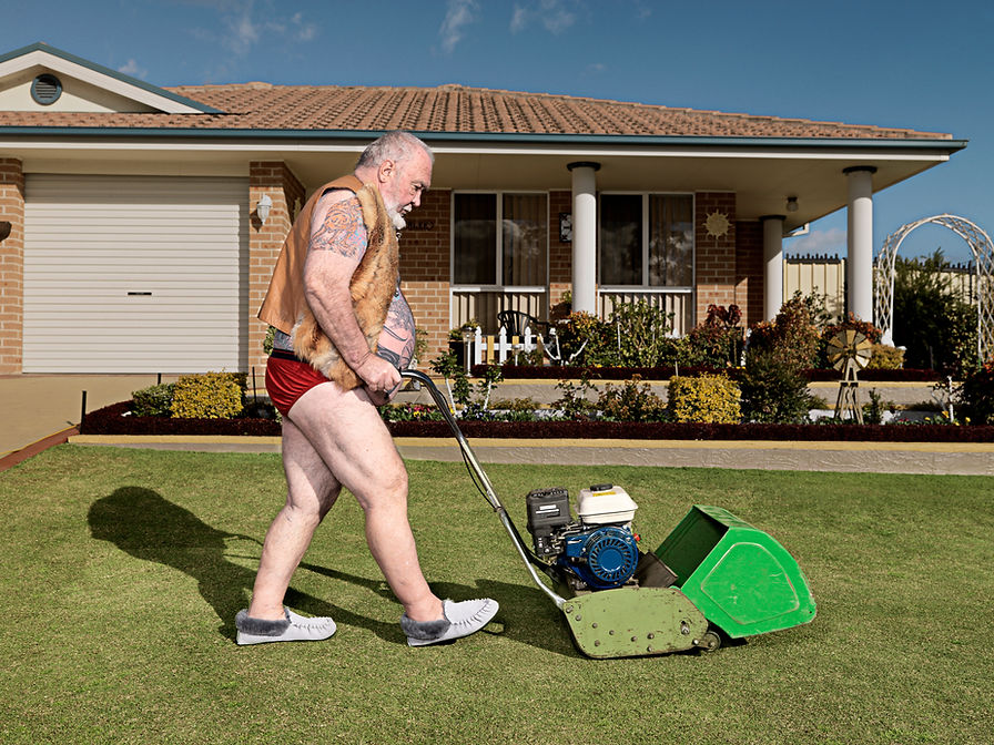 Man Mowing Lawn