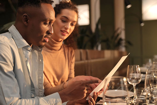 Couple Reviewing Menu