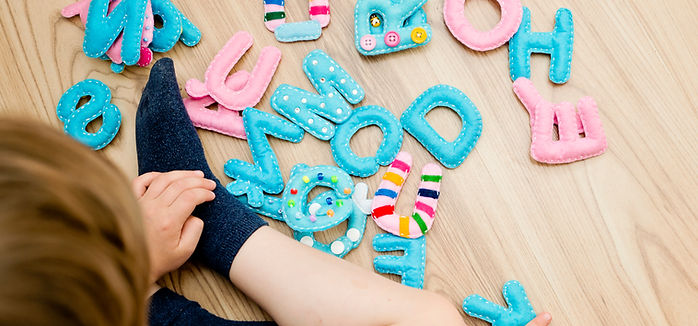 Child Playing Letters