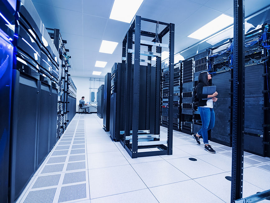 Woman and man working in server room