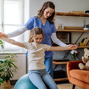 Child with therapist exercise