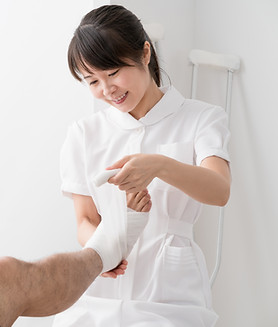 Nurse Helping a Patient