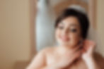 Bride adjusting earrings