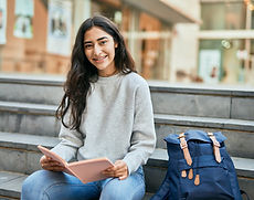 Student Reading Outdoors
